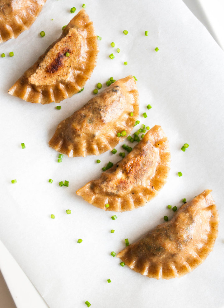 Vegan Potstickers with Tofu – Soft and crispy Chinese dumplings with an umami tofu and mushroom filling. Uses homemade wholegrain dumpling dough. This vegan gyoza recipe is super healthy and incredibly satisfying. Great vegan appetizer. By @deliciouscratch | deliciousfromscratch.com