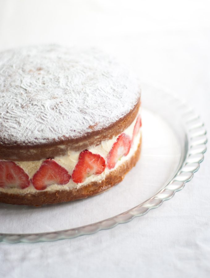 Victoria Sandwich Cake with Strawberries – A classic English cake recipe, here with whipped cream, fresh strawberries and camomile. A gorgeous summer dessert recipe. By @deliciouscratch | deliciousfromscratch.com