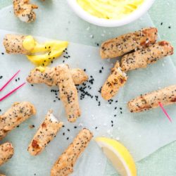 Halloumi fries recipe with garlic mayonnaise dip from How to Cook Halloumi cookbook by Nancy Anne Harbord. Deep fried halloumi with a crispy nigella seed batter – dip in homemade garlic mayonnaise for sensational party snacks! By @deliciouscratch | deliciousfromscratch.com