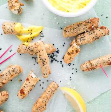 Halloumi fries recipe with garlic mayonnaise dip from How to Cook Halloumi cookbook by Nancy Anne Harbord. Deep fried halloumi with a crispy nigella seed batter – dip in homemade garlic mayonnaise for sensational party snacks! By @deliciouscratch | deliciousfromscratch.com