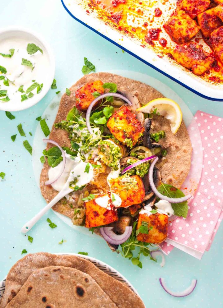 Harissa halloumi kebabs recipe with spelt wraps from How to Cook Halloumi cookbook by Nancy Anne Harbord. Chunks of halloumi roasted with harissa chilli sauce. Pile onto whole grain wraps with sautéed vegetables, herbs and yoghurt for an easy vegetarian dinner. By @deliciouscratch | deliciousfromscratch.com