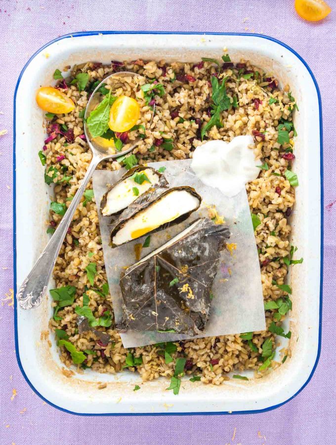 Marinated halloumi in vine leaves recipe from How to Cook Halloumi cookbook by Nancy Anne Harbord. Marinated halloumi in wrapped in vine leaves and baked until soft and tender. Serve with baked freekeh with barberries and avocado salad. A vegetarian Middle Eastern feast! By @deliciouscratch | deliciousfromscratch.com
