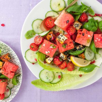 Halloumi watermelon salad recipe from How to Cook Halloumi cookbook by Nancy Anne Harbord. Toasted halloumi coated in seeds with pomegranate, mint and tomato. A bright, halthy halloumi salad absolutely packed with flavour. By @deliciouscratch | deliciousfromscratch.com