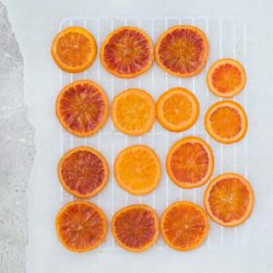 Candied blood orange slices recipe – a beautiful garnish for cakes and desserts.