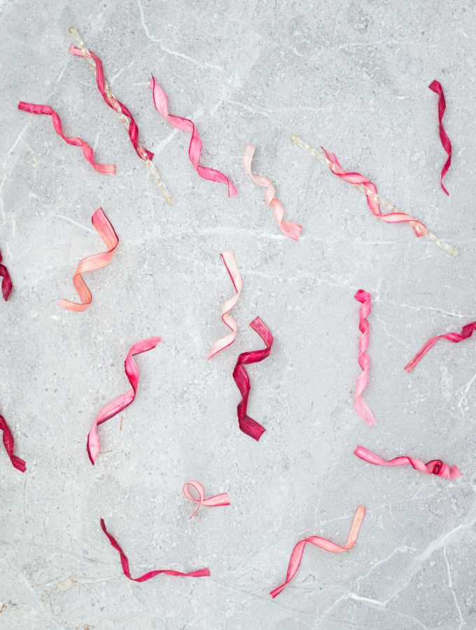 A simple, strikingly beautiful rhubarb garnish for cakes, desserts and cocktails. Just soak strips of rhubarb in sugar syrup and dry out in the oven.