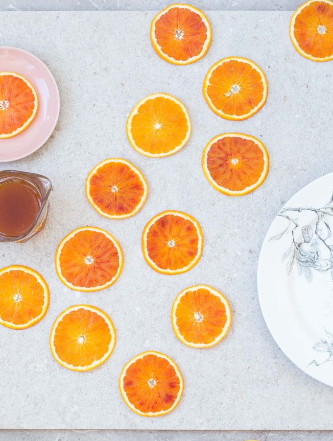 Candied blood orange slices recipe – a beautiful garnish for cakes and desserts.
