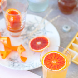 Blood orangeade recipe – an incredibly flavoured orange syrup, topped up with sparkling water. A lovely spring and summer drink.