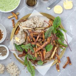 This epic sandwich is made from a whole sourdough loaf, stuffed with crispy oven chips and served with all kinds of sprinkles and dips. A brilliant meal to share.